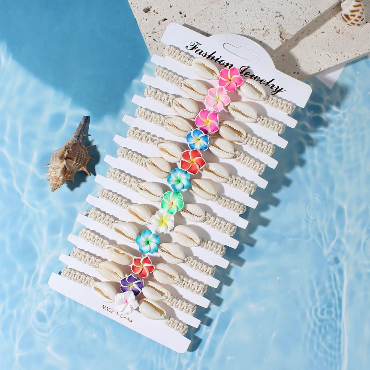 Pingyongchang 12Pcs Hawaiian Plumeria Rubra Seashell Bracelets Cute Handmade Flower Shell Starfish Braided Friendship Bracelet Set for Women Boho Beach Vacation Holiday Jewelry Gift