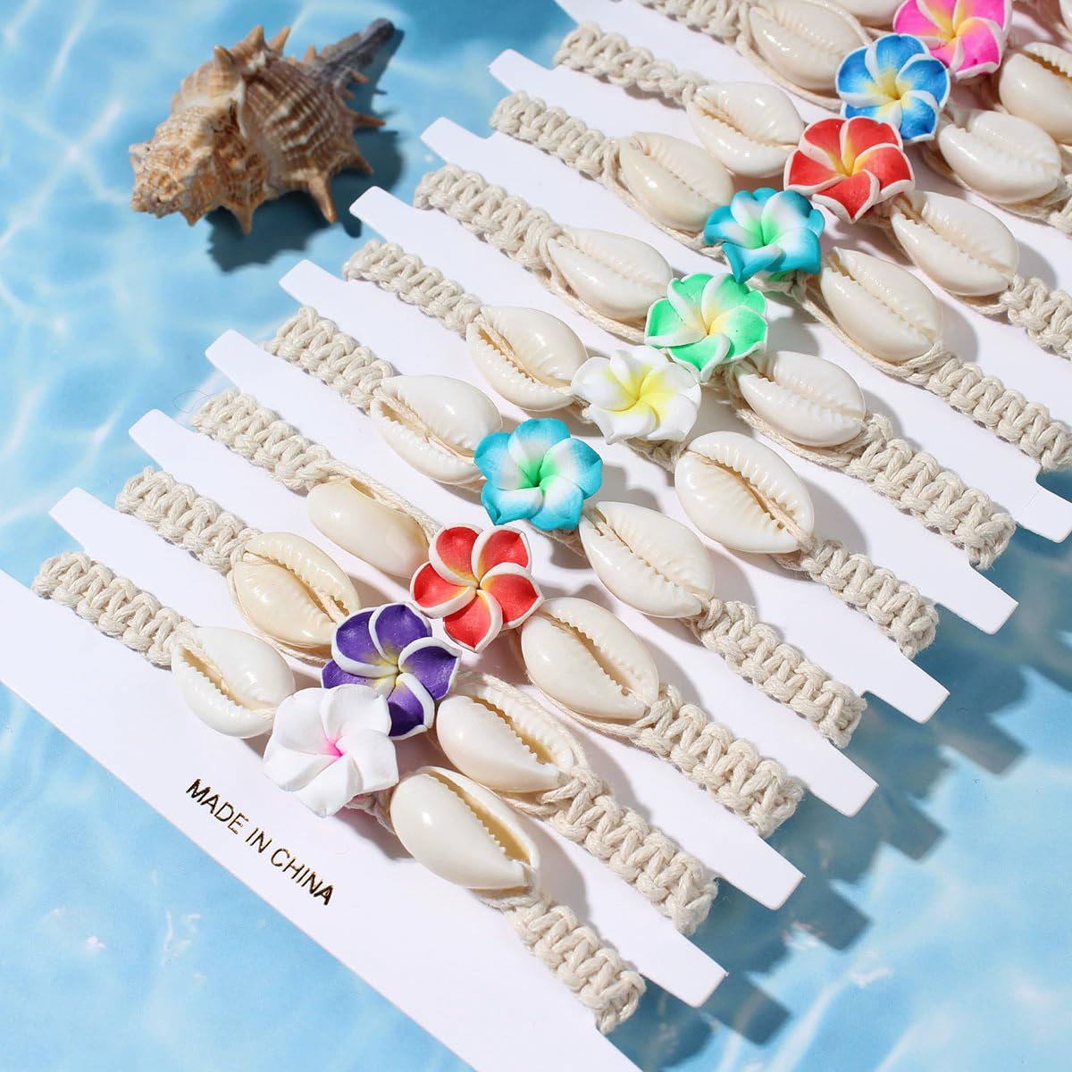 Pingyongchang 12Pcs Hawaiian Plumeria Rubra Seashell Bracelets Cute Handmade Flower Shell Starfish Braided Friendship Bracelet Set for Women Boho Beach Vacation Holiday Jewelry Gift