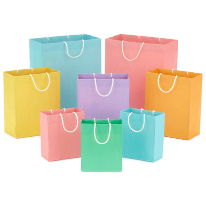 Hallmark Recyclable Gift Bag Assortment (8 Bags: 3 Small 6", 3 Medium 9", 2 Large 13") Pastel Blue, Pink, Yellow, Purple, Orange, Green for Birthdays, Easter, Baby Gifts, Bridal Showers