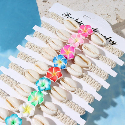 Pingyongchang 12Pcs Hawaiian Plumeria Rubra Seashell Bracelets Cute Handmade Flower Shell Starfish Braided Friendship Bracelet Set for Women Boho Beach Vacation Holiday Jewelry Gift