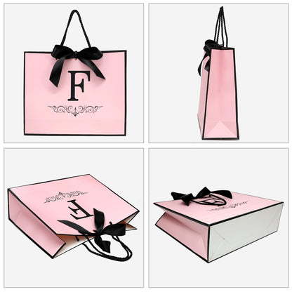 KeerXunBag personalized pink gift Bag with the first letter F- a letter combination paper bag set featuring bows, tissues, greeting cards and envelopes, suitable for ladies, girls' birthdays and weddings