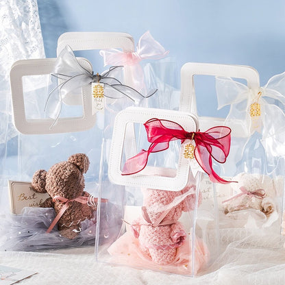 Rmannke Clear Gift Bag with Handle, 4 Pcs Transparent PVC Gift Bag, Heavy Duty Reusable Gift Wrap Bags for Bridal Party, Baby Shower, Wedding Favor, Shopping Bag Bulk- 7"x4" x8"