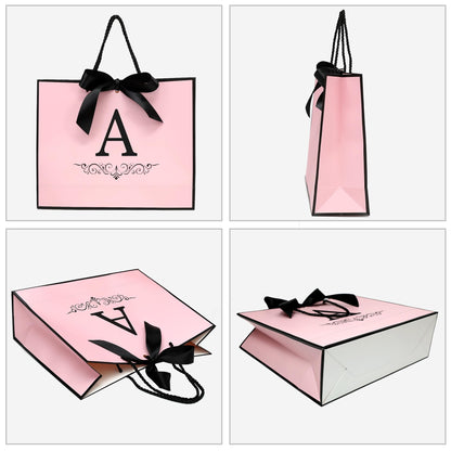 KeerxunBag Paper Personalized Gift Bags for Women Girls with Initial - Monogrammed Pink Paper Gift Bag with Ribbon Bow, Matching Tissue Paper, Card and Envelope Sticker (A, Medium)