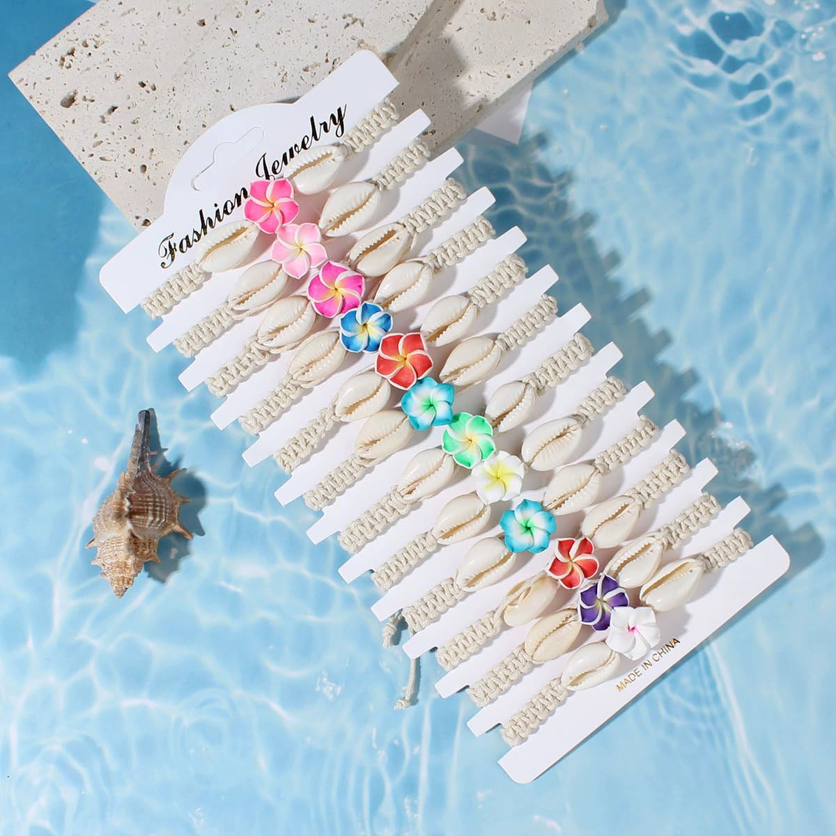 Pingyongchang 12Pcs Hawaiian Plumeria Rubra Seashell Bracelets Cute Handmade Flower Shell Starfish Braided Friendship Bracelet Set for Women Boho Beach Vacation Holiday Jewelry Gift