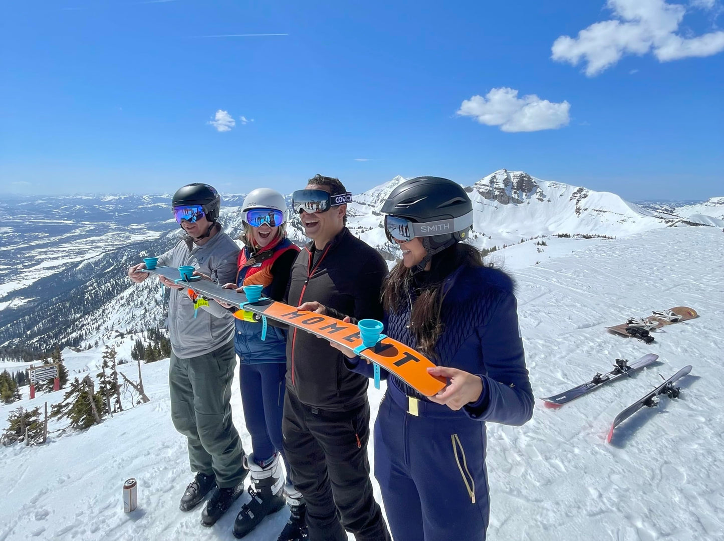 Collapsible and Portable Shot Ski Kit - 4-pack w/ carrying pack. Silicone cups with an adjustable strap that turn any object into a "shot ski"