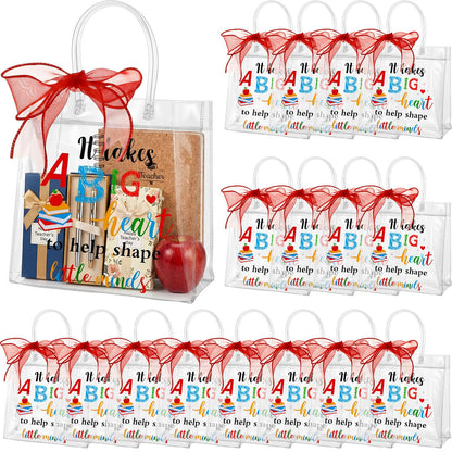 Henoyso 24 Pcs Teacher Appreciation Gift Bags Bulk Clear PVC Party Favor Bags with Handles and Ribbon, 7.8 x 7.8 x 3.1 Inches Plastic Candy Goodie Treat Totes for End of Year Wrapping Supplies