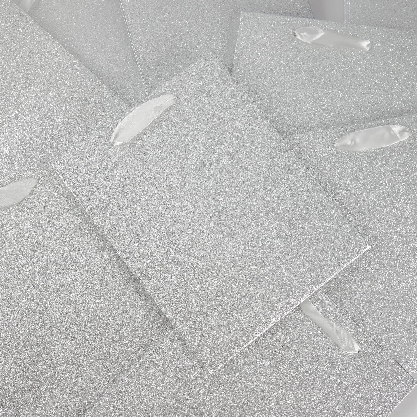 UNIQOOO 12Pcs Embossed Silver Glitter Christmas Gift Bags with 24 Tissue Paper Bulk, M 9x7 Inch, Xmas Silver Gift Wrap Bags, Wedding Bridal Baby Shower Favor Bag Gift Packaging, Birthday Holiday Party